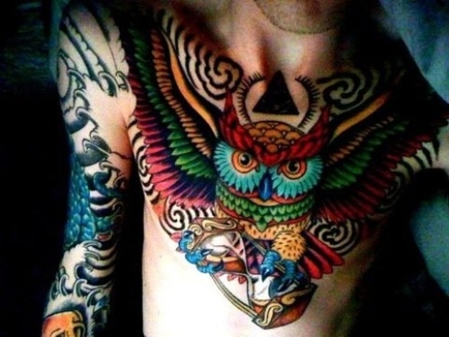 A-colorful-and-creative-bird-tattoo-of-an-owl-holding-an-hourglass-symbolizing-wisdom-and-time